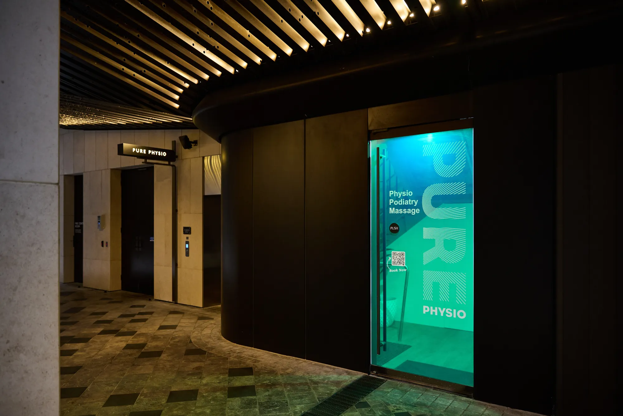 Green door entrance to Pure Physio at 80 Collins Street for Pride Podiatry Melbourne CBD