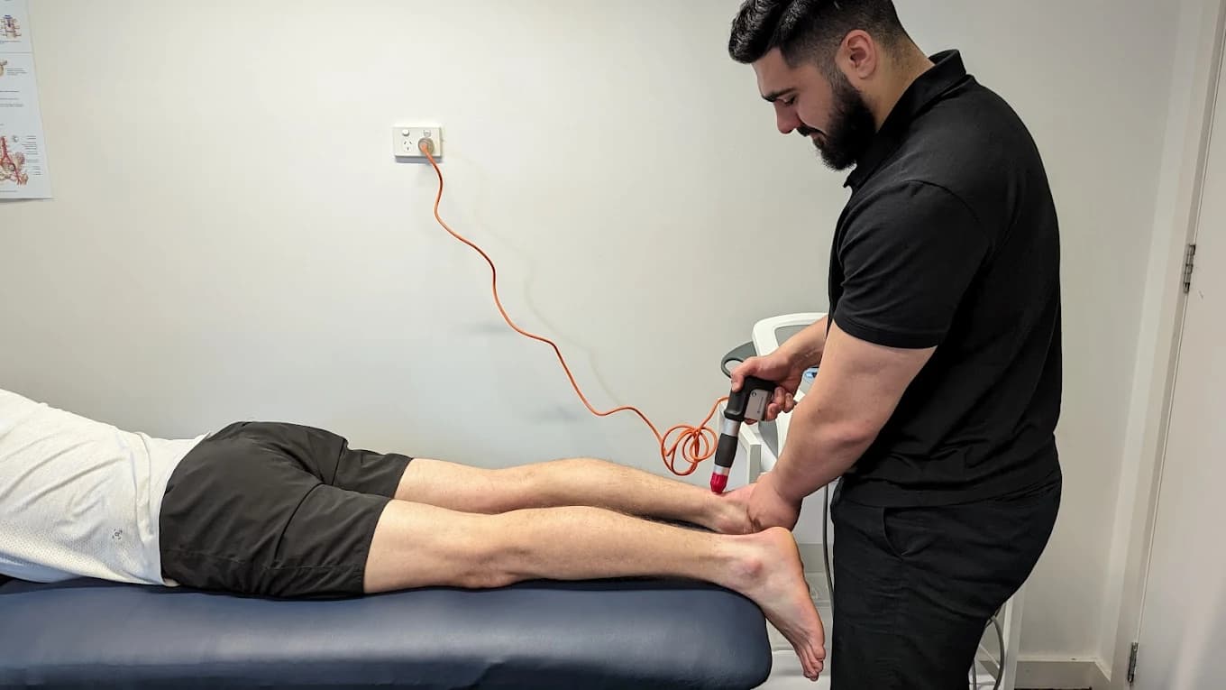 Tim performing shockwave therapy at Pride Podiatry Melbourne
