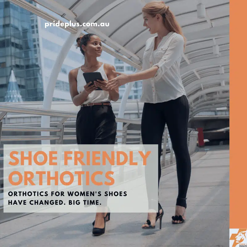 orthotics for women's shoes as two corporate women walk smiling without sore feet