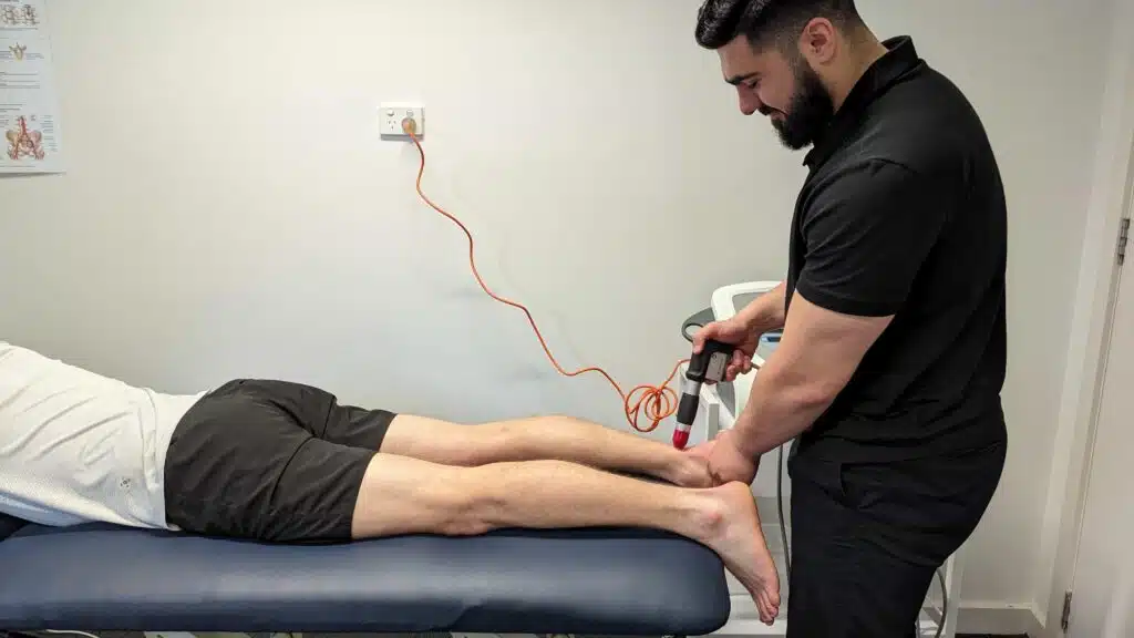 shockwave therapy with podiatrist and physiotherapist on achilles tendonitis
